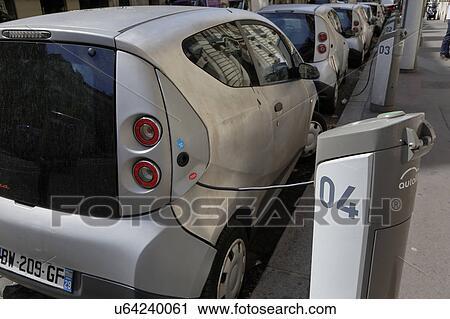 Electric car is recharging, Renault, in Paris, France View Large Photo Image Stock Image - Electric car is recharging, Renault, in Paris, France. Fotosearch