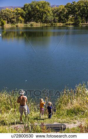Father and children are fishing South of Montrose Colorado, off the Uncompahgre, on Chipeta Lakes, Montrose, Colorado View Large Photo Image Stock Image - Father and children are fishing South of Montrose Colorado, off the Uncompahgre, on Chipeta Lakes, Montrose, Colorado. Fotosearch