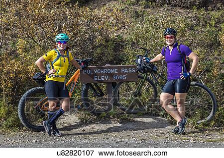 Females mountain biking at Polychrome Pass, Denali National Park, Interior, Alaska View Large Photo Image Stock Photo - Females mountain biking at Polychrome Pass, Denali National Park, Interior, Alaska. Fotosearch