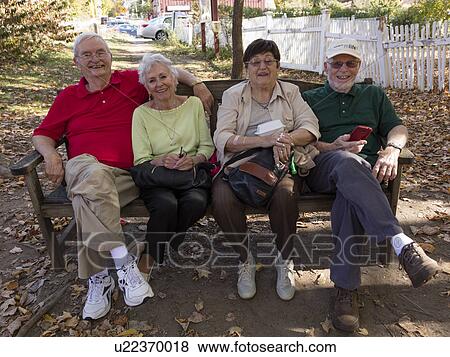 Four Senior sit on bench, West Cornwall overlooking Housatonic River, West Cornwall, Connecticut, USA View Large Photo Image Stock Photo - Four Senior sit on bench, West Cornwall overlooking Housatonic River, West Cornwall, Connecticut, USA. Fotosearch