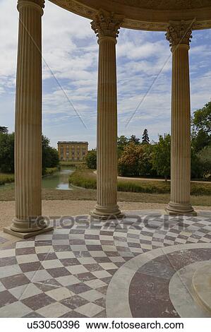 Stock Photograph - Gardens of Marie Antoinette's estate, gardens ofFrance, Yvelines, Versailles, palace of Versailles listed as World Heritage Sight. Fotosearch