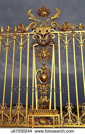 Golden entry gates of Chateau De Versailles with setting sunlight, France View Large Photo Image Picture - Golden entry gates of Chateau De Versailles with setting sunlight, France. Fotosearch