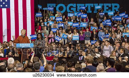 Picture - Hillary Clinton and US First Lady Michelle Obama appear at a presidential campaign event in North Carolina. Fotosearch