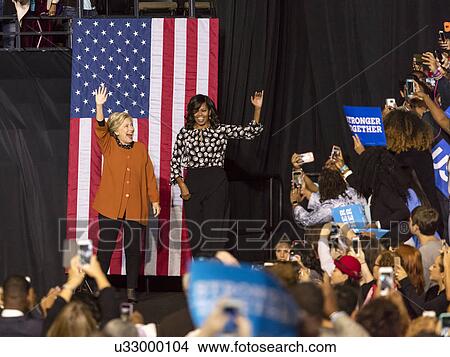 Hillary Clinton and US First Lady Michelle Obama appear at a presidential campaign event in North Carolina View Large Photo Image Picture - Hillary Clinton and US First Lady Michelle Obama appear at a presidential campaign event in North Carolina. Fotosearch