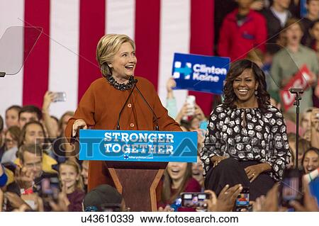 Hillary Clinton and US First Lady Michelle Obama appear at a presidential campaign event in North Carolina View Large Photo Image Stock Photo - Hillary Clinton and US First Lady Michelle Obama appear at a presidential campaign event in North Carolina. Fotosearch