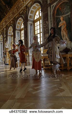 Stock Image - Historical reenactors at the Chateau de Versailles, the estate of Versaille was the home and court of Louis XIV, France. Fotosearch