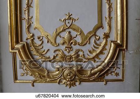 Picture - Interior Gold Relief at Courtyard of Chateau de Versailles, the estate of Versaille home of Louis XIV, France. Fotosearch