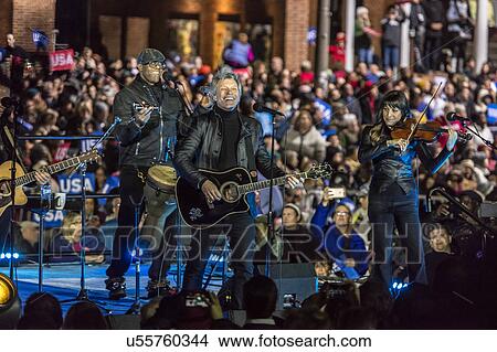 Jon Bon Jovi performs for Hillary Clinton Holds Election Eve Get Out the Vote Rally With Jon Bon Jovi and President and Michelle Obama, Bill and Chelsea Clinton. View Large Photo Image Picture - Jon Bon Jovi performs for Hillary Clinton Holds Election Eve Get Out the Vote Rally With Jon Bon Jovi and President and Michelle Obama, Bill and Chelsea Clinton. . Fotosearch