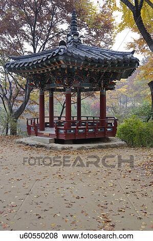 Stock Photo - Korean pagoda in autumn color at Namsangol traditional folk village, Seoul, South Korea. Fotosearch