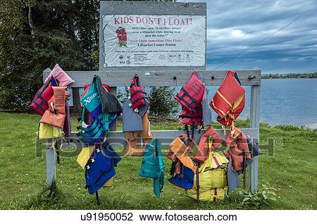 Lifejackets save lives, warning on lake, outside of Anchorage, Alaska View Large Photo Image Stock Image - Lifejackets save lives, warning on lake, outside of Anchorage, Alaska. Fotosearch