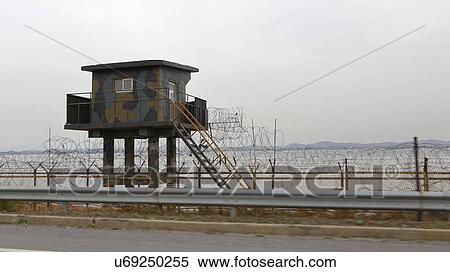 Lookout tower Barbed wire fence separates South from North Korea - Asia View Large Photo Image Stock Photography - Lookout tower Barbed wire fence separates South from North Korea - Asia. Fotosearch