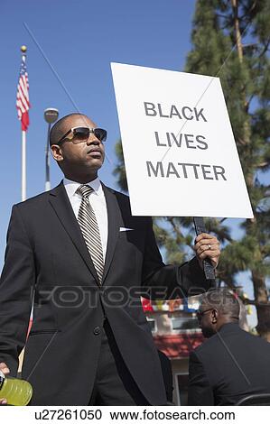 Los Angeles, California, USA, January 19, 2015, 30th annual Martin Luther King Jr. Kingdom Day Parade, black man hold sign Black Lives Matter View Large Photo Image Stock Image - Los Angeles, California, USA, January 19, 2015, 30th annual Martin Luther King Jr. Kingdom Day Parade, black man hold sign Black Lives Matter. Fotosearch