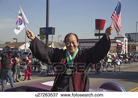 Stock Photo - Los Angeles, California, USA, January 19, 2015, 30th annual Martin Luther King Jr. Kingdom Day Parade, Korean American holds flags. Fotosearch