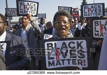 Stock Photo - Los Angeles, California, USA, January 19, 2015, 30th annual Martin Luther King Jr. Kingdom Day Parade, women hold sign Black Lives Matter. Fotosearch