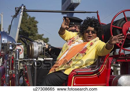 Stock Photography - Los Angeles, California, USA, January 19, 2015, 30th annual Martin Luther King Jr. Kingdom Day Parade, black woman smiles in parade. Fotosearch