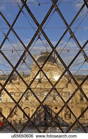 Stock Photograph - Louvre Museum Pyramid at sunset, Paris France. Fotosearch