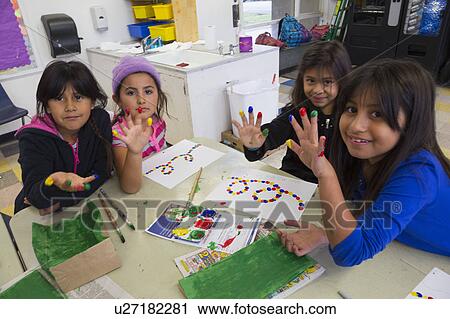 Stock Image - Oak View, California, USA, December 15, children doing finger painting after school. Fotosearch