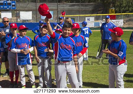 Oak View, California, USA, March 7, 2015, Ojai Valley Little League Field, youth Baseball, Spring, raise their caps when name is announced View Large Photo Image Stock Image - Oak View, California, USA, March 7, 2015, Ojai Valley Little League Field, youth Baseball, Spring, raise their caps when name is announced. Fotosearch