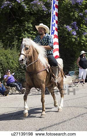 Oak View, California, USA, May 24, 2015, Memorial Day Parade with cowboy and US Flag View Large Photo Image Stock Photo - Oak View, California, USA, May 24, 2015, Memorial Day Parade with cowboy and US Flag. Fotosearch