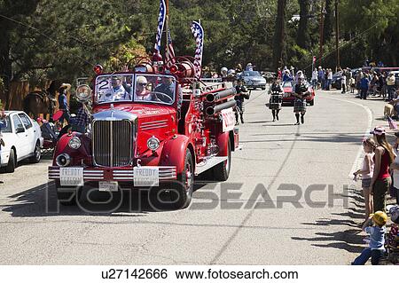 Stock Photograph - Oak View, California, USA, May 24, 2015, antique fire engine leads Memorial Day Parade. Fotosearch