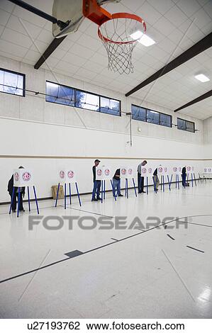 Stock Image - Oak View, California, USA, November 4, 2014, citizen votes in election booth polling station in gymnasium. Fotosearch