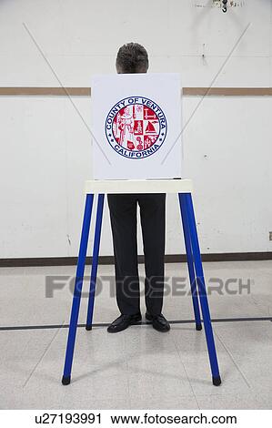 Stock Image - Oak View, California, USA, November 4, 2014, citizen votes in election booth polling station in gymnasium. Fotosearch
