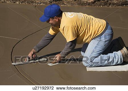 Oak View, California, USA, October 18, 2014, Hispanic concrete workers spread wet concrete for driveway View Large Photo Image Stock Image - Oak View, California, USA, October 18, 2014, Hispanic concrete workers spread wet concrete for driveway. Fotosearch