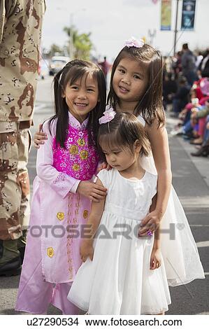 Orange County, City of Westminster, Southern California, USA, February 21, 2015, Little Saigon, Vitenamese-American Community, TET Parade celebrates Tet Lunar New Year, little girls View Large Photo Image Picture - Orange County, City of Westminster, Southern California, USA, February 21, 2015, Little Saigon, Vitenamese-American Community, TET Parade celebrates Tet Lunar New Year, little girls. Fotosearch