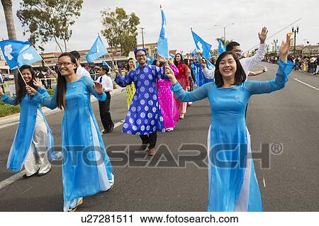 Stock Image - Orange County, City of Westminster, Southern California, USA, February 21, 2015, Little Saigon, Vitenamese-American Community, TET Parade celebrates Tet Lunar New Year, women march in parade. Fotosearch