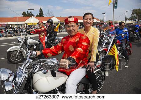 Stock Photo - Orange County, City of Westminster, Southern California, USA, February 21, 2015, Little Saigon, Vitenamese-American Community, TET Parade celebrates Tet Lunar New Year, motorcycles in parade. Fotosearch
