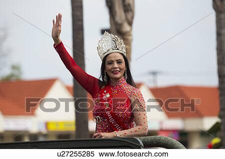Stock Photography - Orange County, City of Westminster, Southern California, USA, February 21, 2015, Little Saigon, Vitenamese-American Community, TET Parade celebrates Tet Lunar New Year, women wave. Fotosearch