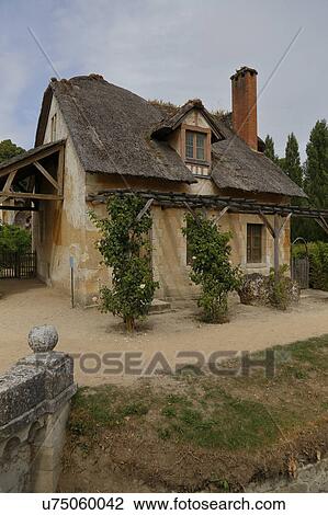 Stock Image - Queen Marie-Antoinette's hamlet, Versailles, France. Fotosearch