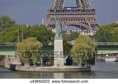Replica of the Statue of Liberty and Eiffel Tower, view from the River Seine - Paris, France View Large Photo Image Stock Image - Replica of the Statue of Liberty and Eiffel Tower, view from the River Seine - Paris, France. Fotosearch