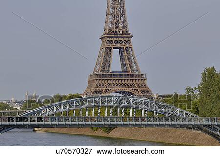 Replica of the Statue of Liberty and Eiffel Tower and Debilly Footbridge over River Seine - Paris, France View Large Photo Image Stock Photo - Replica of the Statue of Liberty and Eiffel Tower and Debilly Footbridge over River Seine - Paris, France. Fotosearch