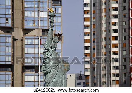Stock Photography - Replica of the Statue of Liberty and modern buildings, Paris, France. Fotosearch