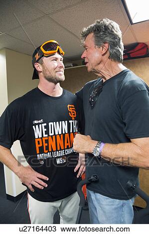Stock Image - San Francisco, California, USA, October 16, 2014, AT&T Park, baseball stadium, SF Giants versus St. Louis Cardinals, National League Championship Series (NLCS), Hunter Strickland (left) speaks to Uncle Bill Terry. Fotosearch