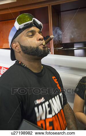Stock Image - San Francisco, California, USA, October 16, 2014, AT&T Park, baseball stadium, SF Giants versus St. Louis Cardinals, National League Championship Series (NLCS), Pablo Sandoval celebrates in dugout. Fotosearch