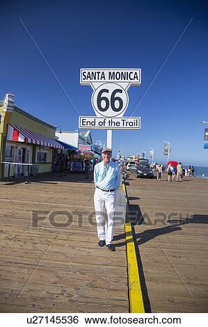 Santa Monica, California, USA 5/2/2015, Route 66 sign and photographer Joe Sohm at Santa Monica Pier, end of famous Route 66 highway from Chicago View Large Photo Image Stock Photograph - Santa Monica, California, USA 5/2/2015, Route 66 sign and photographer Joe Sohm at Santa Monica Pier, end of famous Route 66 highway from Chicago. Fotosearch