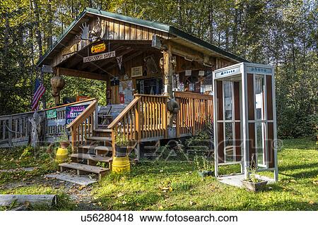 Sourdough Dru's Alaskan cabin with telephone booth, Hope, Alaska View Large Photo Image Stock Photo - Sourdough Dru's Alaskan cabin with telephone booth, Hope, Alaska. Fotosearch
