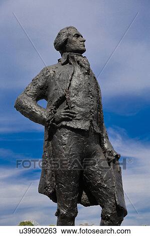 Stock Image - Statue of Thomas Jefferson, by JeanCardot shows him holdingarchitectural drawings of Monticello, Paris, France - Jefferson 1743 -1826 - shot August 2015. Fotosearch