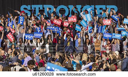 Supporters of Hillary Clinton and US First Lady Michelle Obama participate in a presidential campaign rally in North Carolina View Large Photo Image Stock Photo - Supporters of Hillary Clinton and US First Lady Michelle Obama participate in a presidential campaign rally in North Carolina. Fotosearch