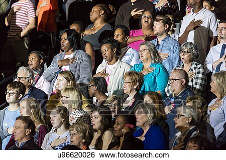 Stock Photograph - Supporters of Hillary Clinton and US First Lady Michelle Obama participate in a presidential campaign rally in North Carolina. Fotosearch