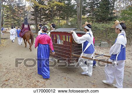Stock Image - Traditional ethnic wedding of folk people at Namsangol traditional folk village, Seoul, South Korea. Fotosearch