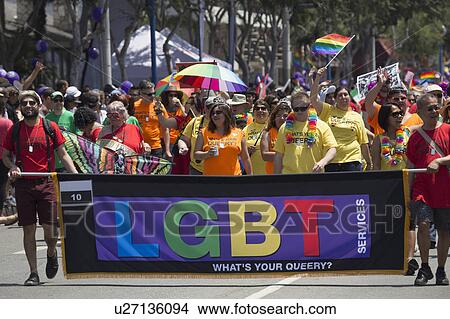 West Hollywood, Los Angeles, California, USA, June 14, 2015, 40th annual Gay Pride Parade for LGBT Community, down Santa Monica Blvd., LGBT Public Library Banner and marchers View Large Photo Image Picture - West Hollywood, Los Angeles, California, USA, June 14, 2015, 40th annual Gay Pride Parade for LGBT Community, down Santa Monica Blvd., LGBT Public Library Banner and marchers. Fotosearch