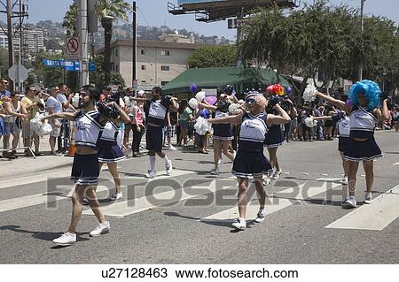 Stock Image - West Hollywood, Los Angeles, California, USA, June 14, 2015, 40th annual Gay Pride Parade for LGBT Community, down Santa Monica Blvd., males dressed as cheerleaders march in parade. Fotosearch