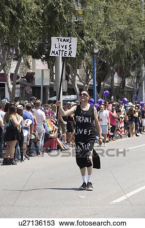 West Hollywood, Los Angeles, California, USA, June 14, 2015, 40th annual Gay Pride Parade for LGBT Community, down Santa Monica Blvd., Trans Lives Matter on sign View Large Photo Image Stock Image - West Hollywood, Los Angeles, California, USA, June 14, 2015, 40th annual Gay Pride Parade for LGBT Community, down Santa Monica Blvd., Trans Lives Matter on sign. Fotosearch