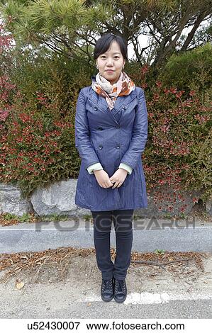 Young woman poses - South Korea, National Capital Area, Seoul View Large Photo Image Stock Photo - Young woman poses - South Korea, National Capital Area, Seoul. Fotosearch