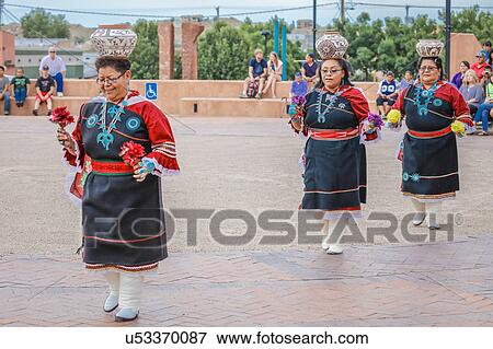 Stock Photo - Zuni Indian Pueblo woman balances pot on her head in ceremony in Gallup, New Mexico. Fotosearch