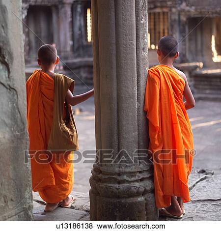 Back view of monks at Khmer Kingdom palace ruins View Large Photo Image Stock Photo - Back view of monks at Khmer Kingdom palace ruins. Fotosearch