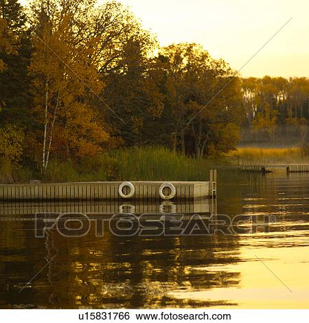 Boat Dock with Sunlight on Lake View Large Photo Image Stock Photograph - Boat Dock with Sunlight on Lake. Fotosearch